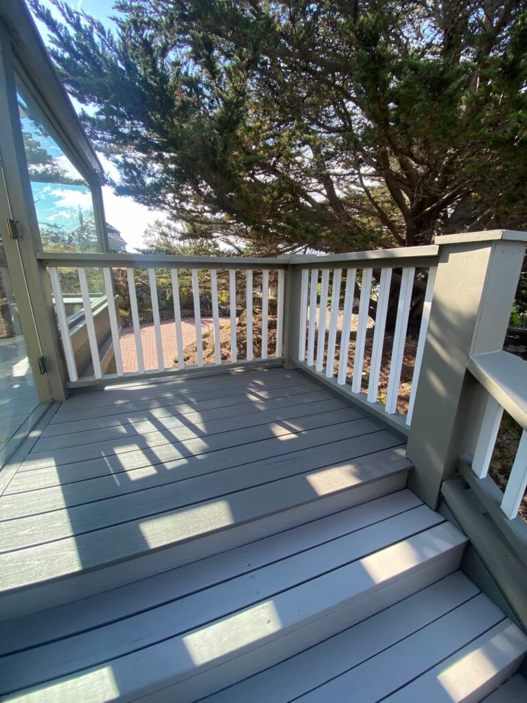 Deck Painting. Newly painted deck. with trees in the background.