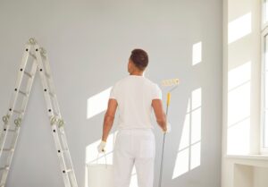 Interior Painting. Professional painter. Painting indoor room.