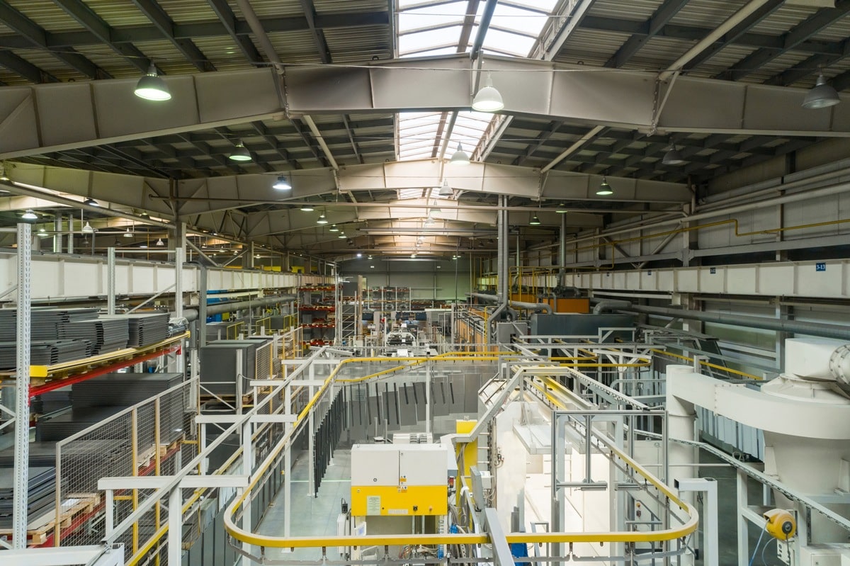 Industrial line of dry painting of metal products. Overhead conveyor system.